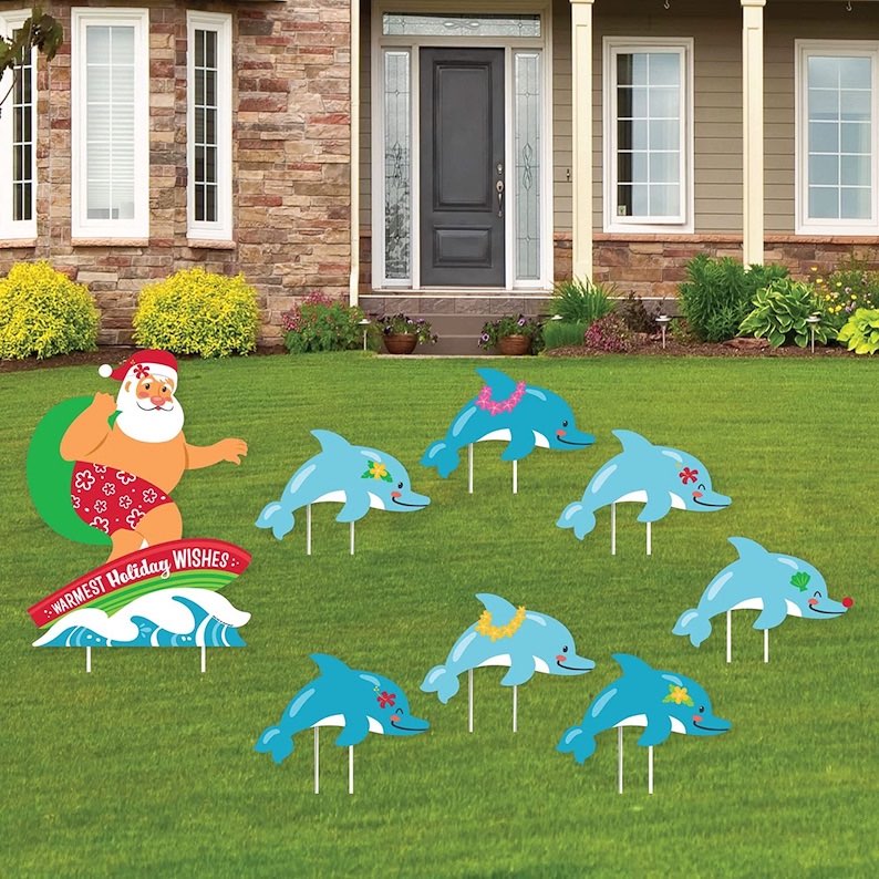 Surfing Santa and Christmas Dolphins Yard Signs