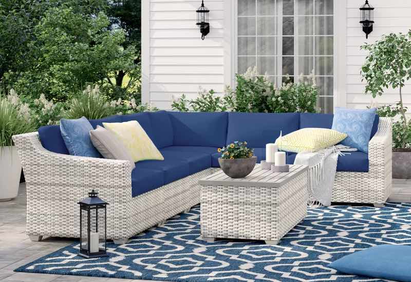 Falmouth 7 Piece Rattan Sectional Seating Group with Cushions