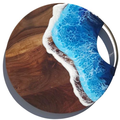 artist: Kelsey Brauer - circular cutting board with resin ocean (resin beach art)